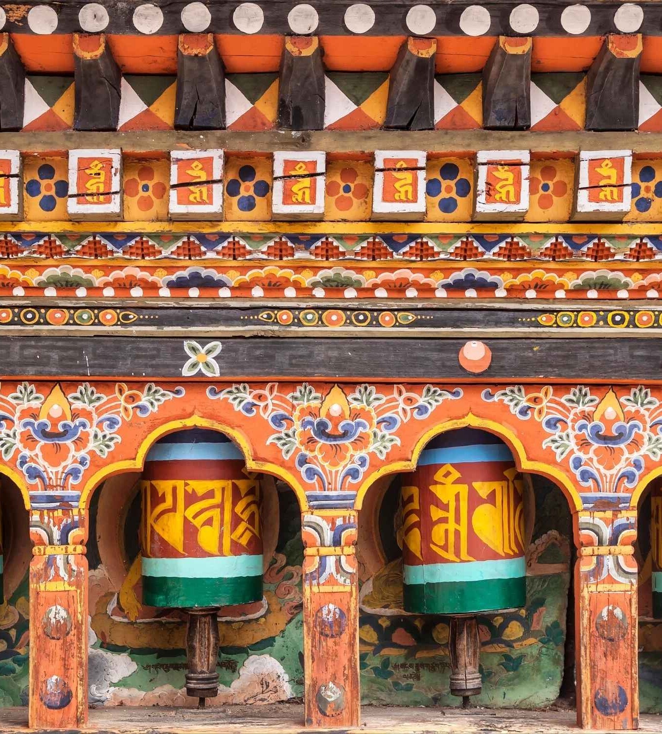 Turning prayer wheels Bhutan Indian Subcontinent